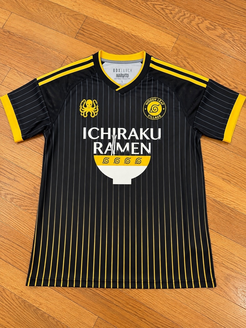 Boxlunch Narato Ichiraku Ramen Black & Yellow Soccer-Style Men’s Shirt
